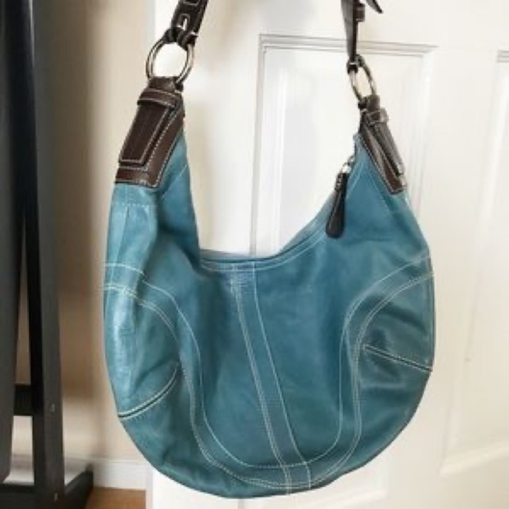 Turquoise Coach shoulder purse with original bag.